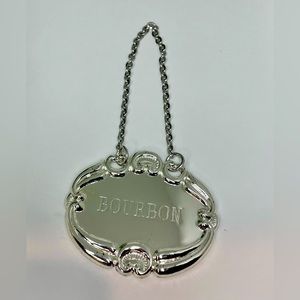 Very vintage spirit bottle silver chain labels. Set of four.